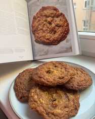 A plate of cookies I baked, next to the recipe book.